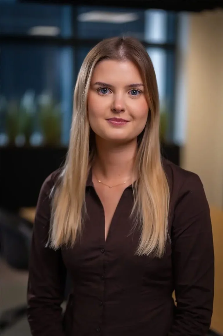 Portrait photo of Daisy Maslin, Client Engagement Principal stood in an open office