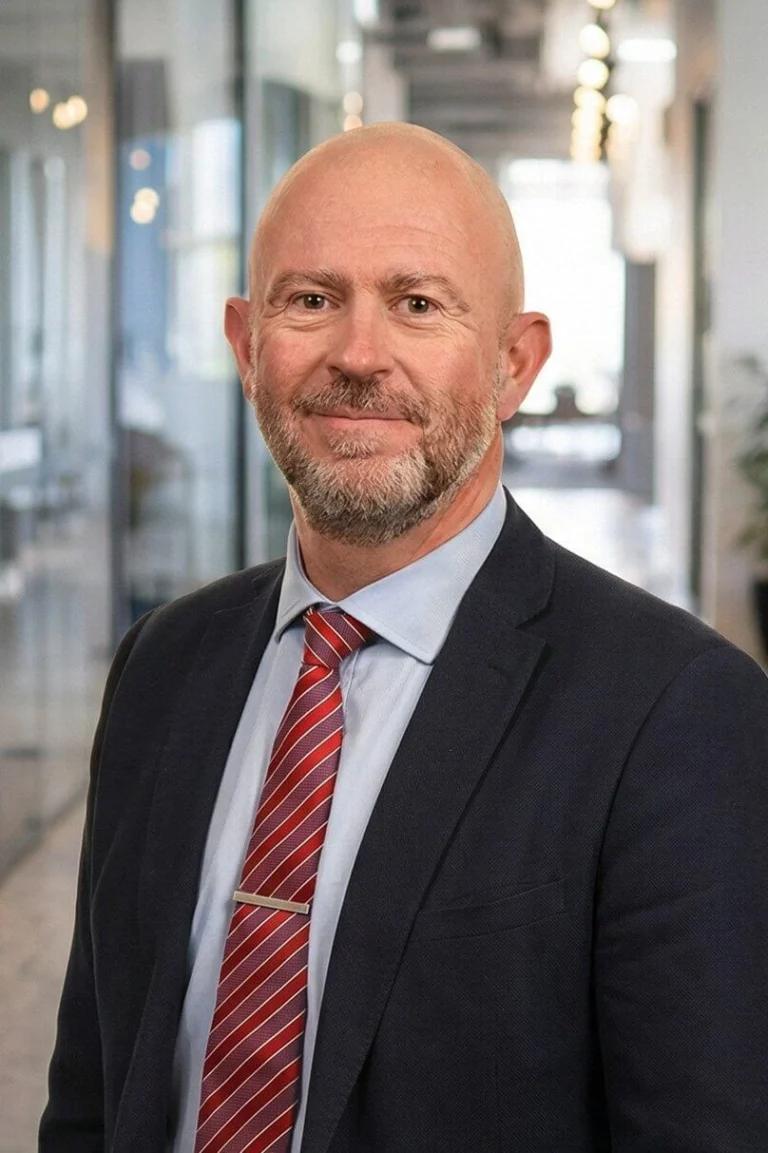 Portrait photo of Richard Beeken, Strategic Advisor stood in an open office